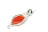 Larger blown glass capsule charm with red-orange parrot feather inside