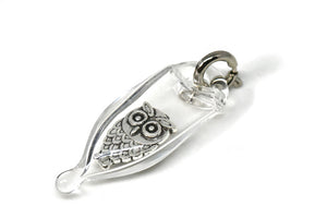 Glass capsule charm with antique brass owl inside glass. 
